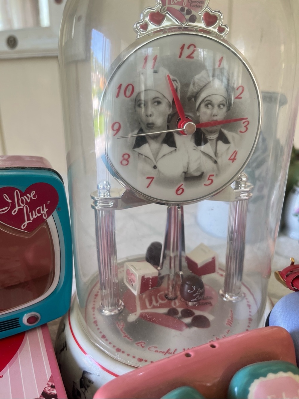 I Love Lucy lot! DVDs, dome clock, glasses case, doll and tin with salt shaker.